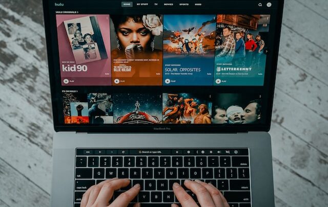 A person using Hulu on a laptop